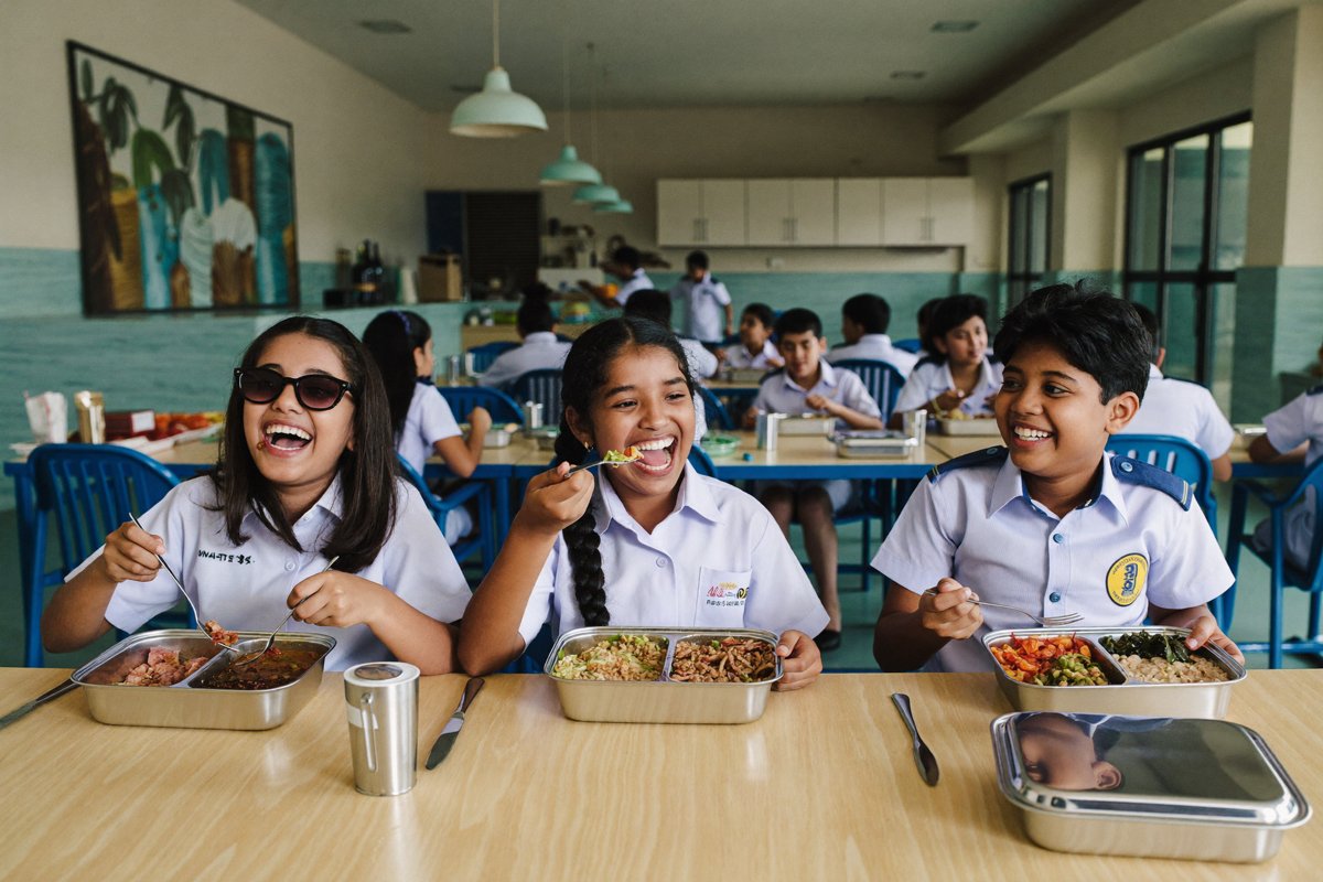 School children enjoying their SchooFoo lunch together